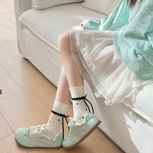 Japanese style white polka dot socks with ribbon bow and mint green casual shoes