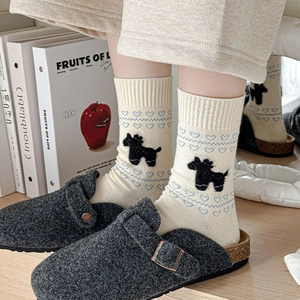 Women's cream knit crew socks with blue heart patterns and cozy grey felt clogs