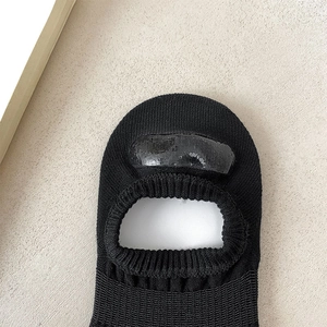 Detail view of the wide non-slip silicone heel grips on black low cut invisible socks