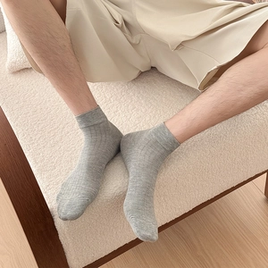 Detailed close-up of breathable grey cotton mesh ankle socks with ribbed elastic cuff