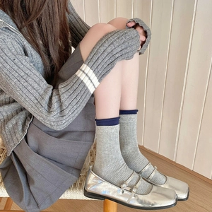 Japanese style grey ribbed mid-calf socks with navy lace cuffs and stylish silver shoes
