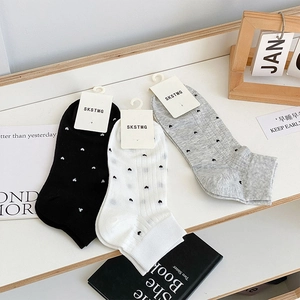 Three pairs of cotton ankle socks in black white and grey with small heart patterns