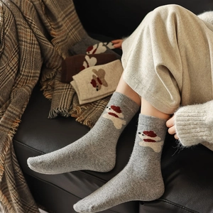 Winter wool knit socks for women featuring cute animal jacquard patterns and thick texture
