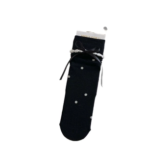 Japanese style black polka dot socks featuring satin bows and delicate pearl trim