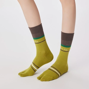 Detail view of striped tabi socks in olive green with 'More Fun' text on the side