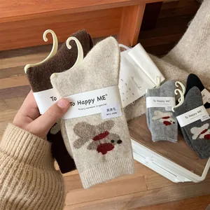 Close-up of assorted wool socks featuring cute cartoon puppy patterns and warm texture
