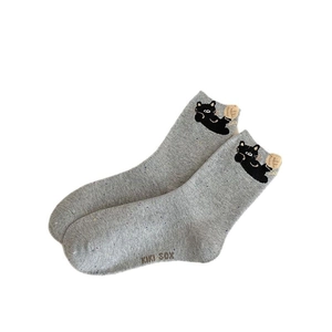 Grey knit crew socks with cute cat embroidery and KIKI SOX logo on white background