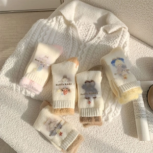 Detailed view of 5-pack thick thermal winter socks with cute cartoon embroidery and warm texture