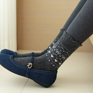 Gray heart bow wool socks with denim shoes featuring warm knit texture for winter