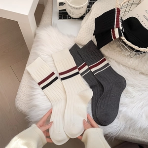 British style thick ribbed knit mid-calf socks with double stripes on plush carpet