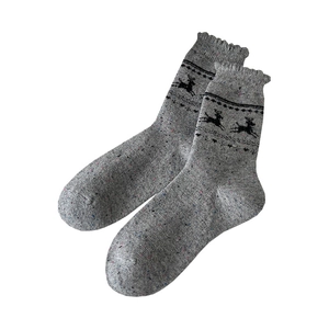 Gray wool socks featuring reindeer jacquard patterns and ruffled cuffs for winter warmth
