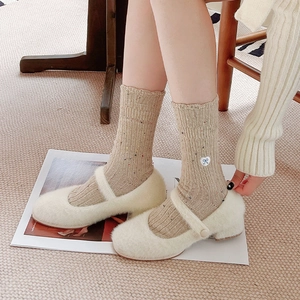 Japanese style wool socks with bow embroidery paired with cream plush Mary Jane shoes