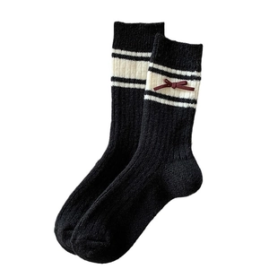 Thick wool socks for women with vertical ribs and decorative 3D red bow ties