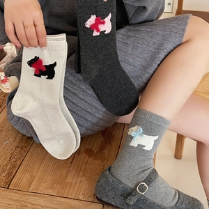 Detailed knit of thermal wool socks featuring 3D bow and cartoon dog embroidery