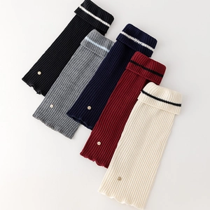 Ribbed knit leg warmers in five colors with metal buttons and striped fold-over cuffs
