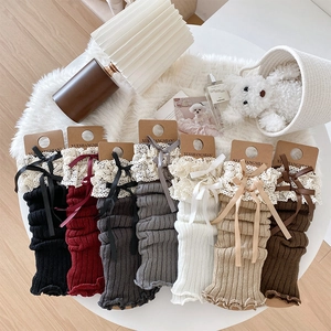 Chic knit leg warmers with lace trim and bow knot details in various stylish colors