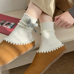 Japanese style cream knit socks with grey bow paired with brown suede wave-stitch mules