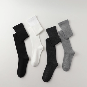 Detailed flat lay of over-the-knee socks in black, white, dark grey and light grey colors