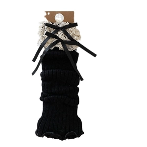 French vintage black knitted leg warmers with lace trim and bowknot accents