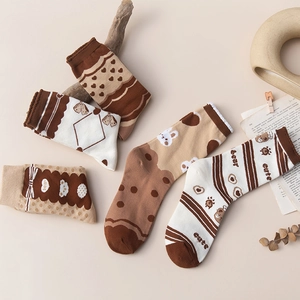 Detail of five pairs of vintage style cotton socks with bear and heart patterns