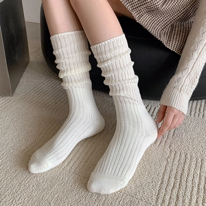 White ribbed knit calf socks for women in a slouchy Japanese style shown on a model