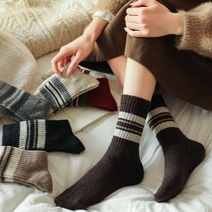 Thick wool socks in assorted colors with retro stripes for winter warmth and comfort