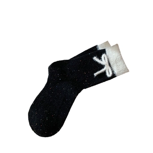 Japanese style black tweed socks with fuzzy white fur trim and sweet plush bow accent