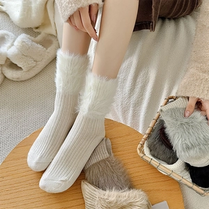 Thick knit white mid-calf socks with faux fur trim for winter warmth and cozy style