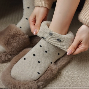 Detail of vintage polka dot wool socks with thick fleece lining for winter warmth