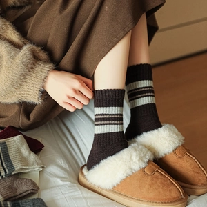 Close-up of wool blend striped socks in dark coffee with retro varsity style texture