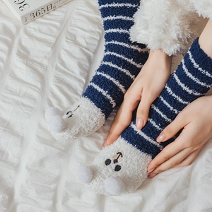 Detailed view of striped coral fleece socks with cute 3D ears and cartoon embroidery
