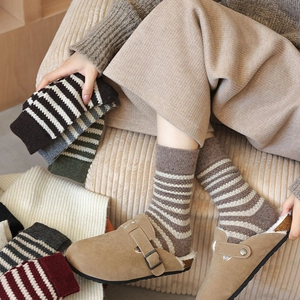 Striped wool socks for women in vintage autumn colors styled with Birkenstock shoes
