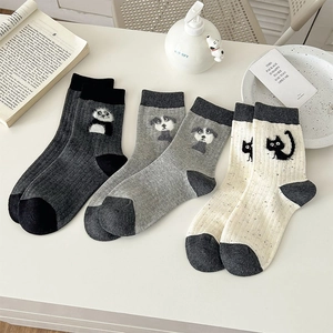 Three pairs of cute animal embroidered mid-calf socks in grey and beige tones