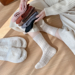 Detail of colorful knitted socks featuring premium geometric textured jacquard patterns