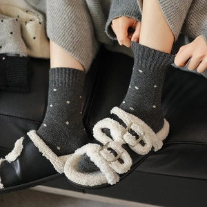 Thick dark grey wool socks with white polka dots for winter warmth and cozy home wear