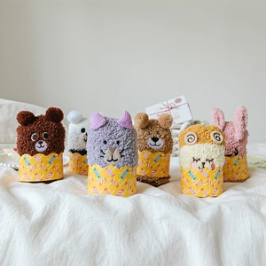 Close-up of 6 pairs of fuzzy coral fleece socks with 3D animal ears and cute embroidery