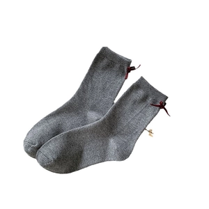 Grey knit crew socks with a deep red silk bow on the back, college style cashmere feel