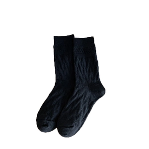 Classic black mid-calf socks with embossed heart pattern and warm thick knit texture