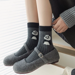 Cute panda pattern dark grey knit mid-calf socks paired with stylish Mary Jane shoes