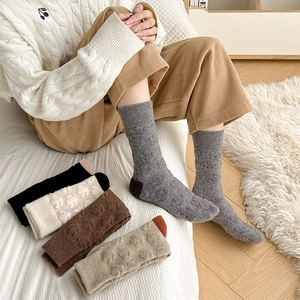 Chic women's wool socks with 3D embossed bear pattern and ribbed cuffs in earthy tones