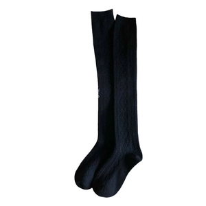 Women's black cashmere over-the-knee socks with classic cable knit and diamond pattern