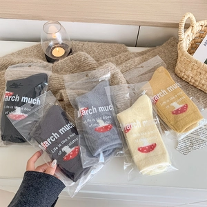 Five-pack of thick wool blend socks with cute mushroom embroidery in retail packaging