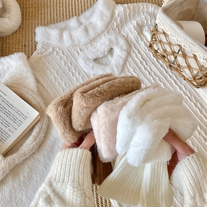 Close-up of thick thermal leg warmers with fluffy faux fur cuffs in various soft winter colors