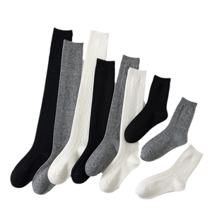 Classic black, white, and grey mid-calf socks with diamond knit texture in various lengths