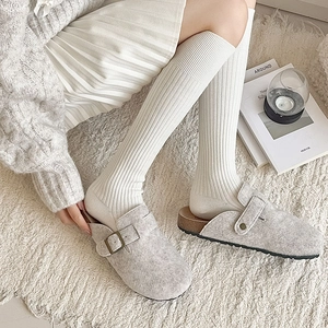 Japanese style outfit featuring light grey felt clogs and white ribbed calf socks