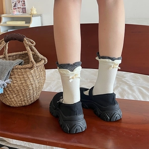 Japanese style cream knit socks with grey ruffled edges and sweet yellow bow accents