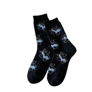Fuzzy black thermal socks for women featuring cute blue bear jacquard patterns