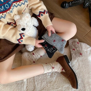Cozy winter wool socks featuring cute bear patterns and sweet bow designs for women