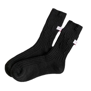 Thick black knitted cashmere socks for women featuring stylish white hand-stitched labels