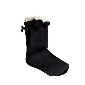 Black crew socks with white ruffled lace trim and sweet ribbon bow decoration